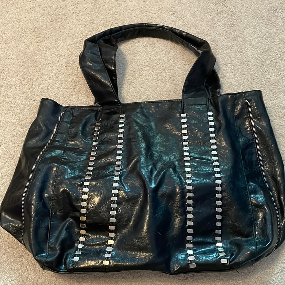 Large black tote with metal accents
